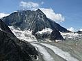 Mont Blanc de Chelion rising above a river of ice flowing down the Val des Dix